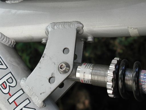 [Cruzbike 'bottle-cage braze-ons' within rear-suspension spring-bracket]