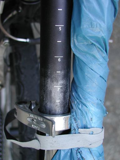 [closeup of scraped adjustable leg at quick-release friction-latch]
