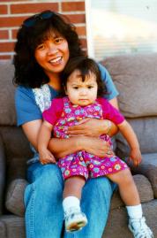 [Lyra sitting on Mom]